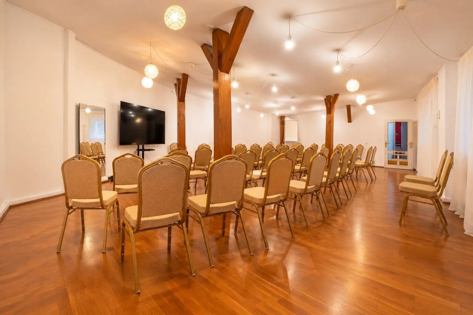 Warm Conference Room with Rows of Chairs