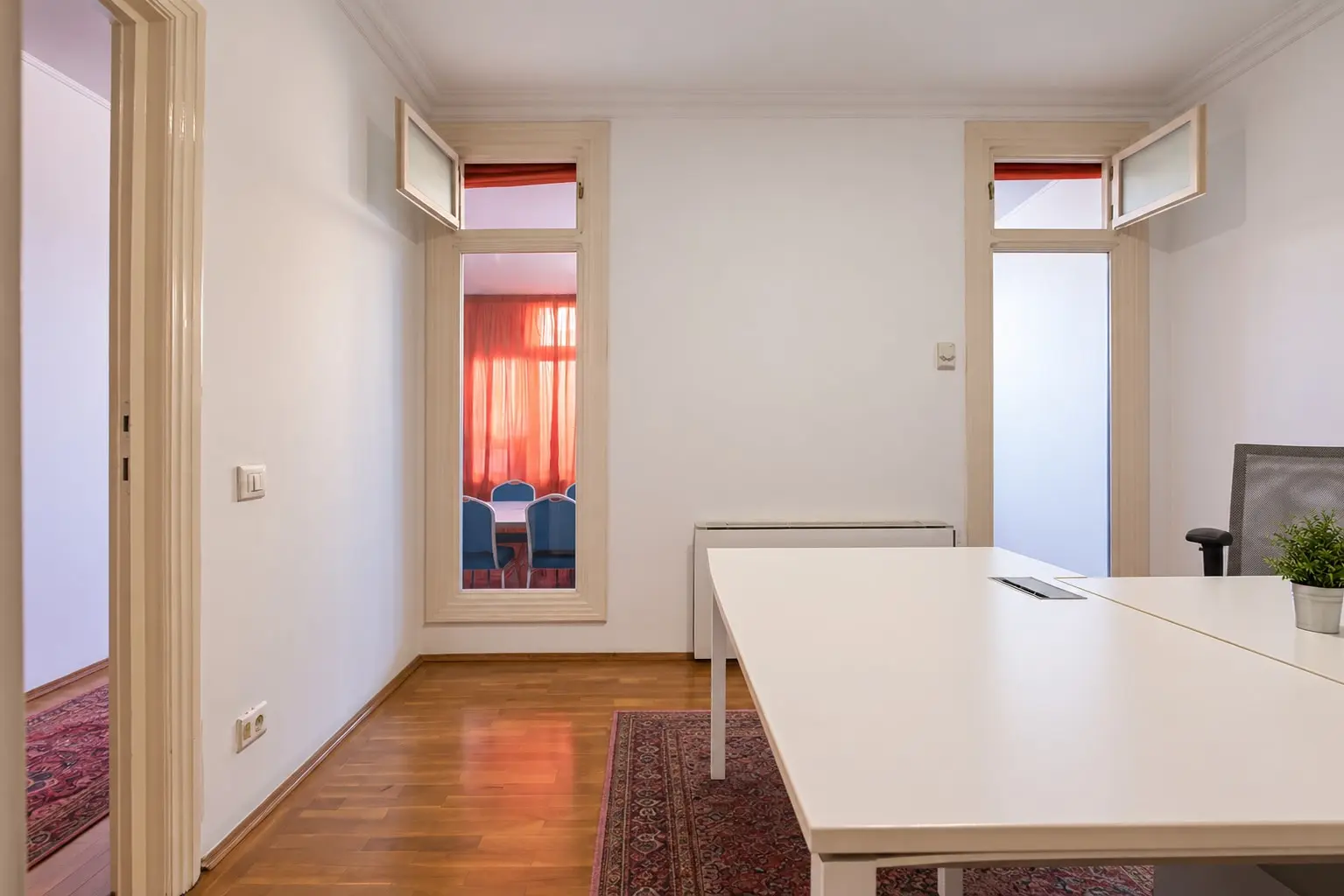 Bright Office with L-Shaped Desk and Windows