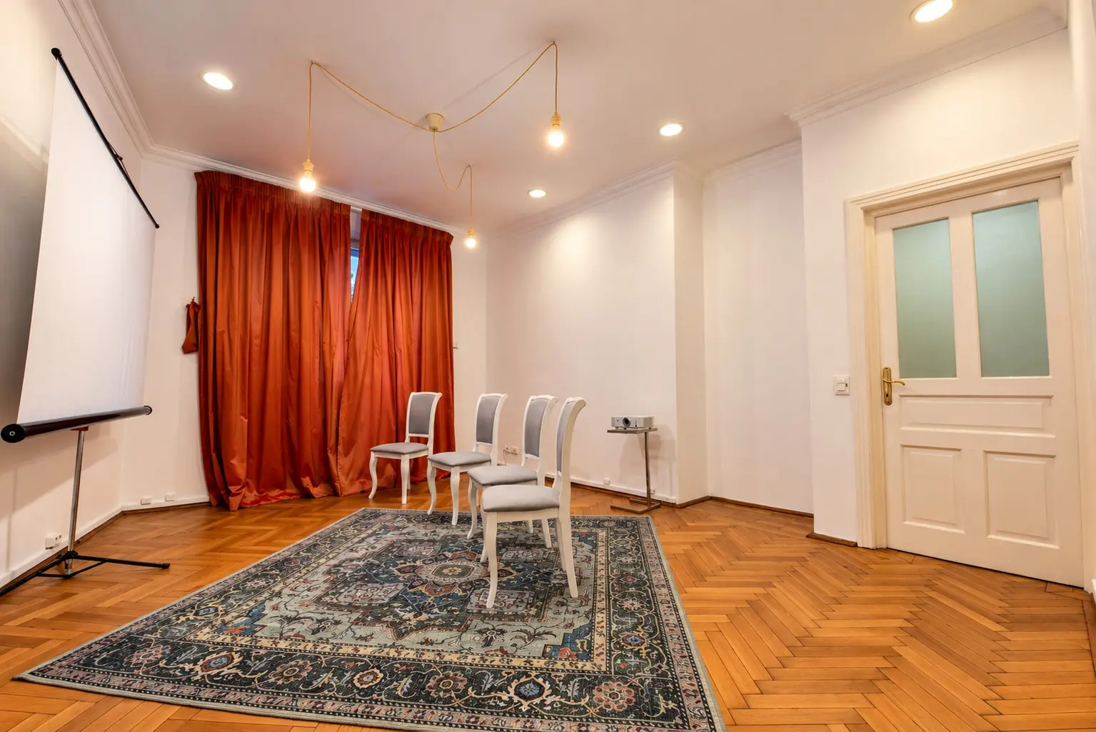 Warm Meeting Room with Projector and Chairs