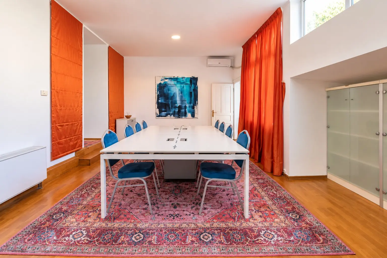 Modern Conference Room with Orange Accents (view 3)