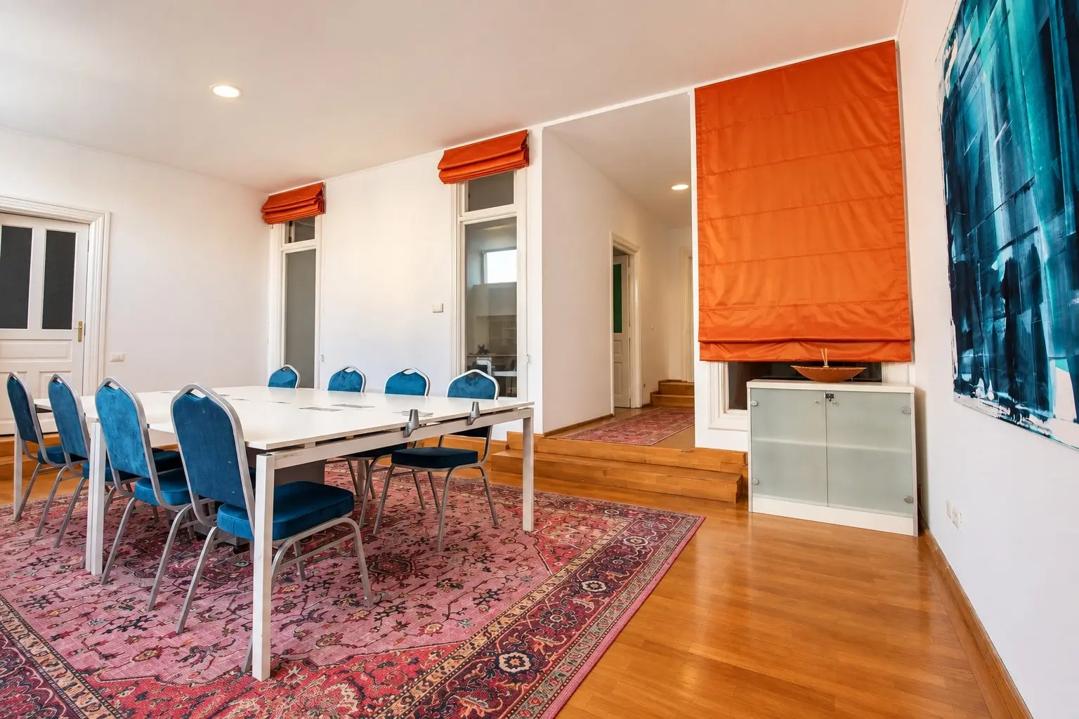 Bright modern conference room with a Persian rug