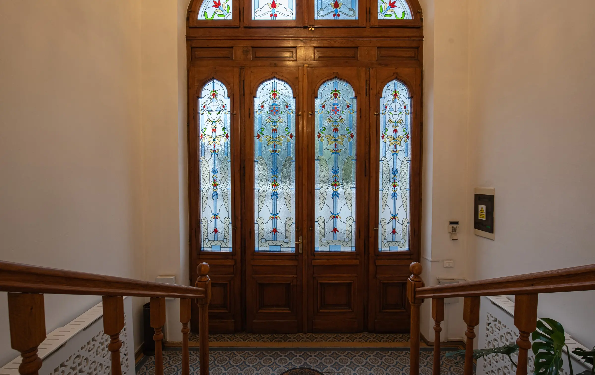 Stained-glass doors above the stairs