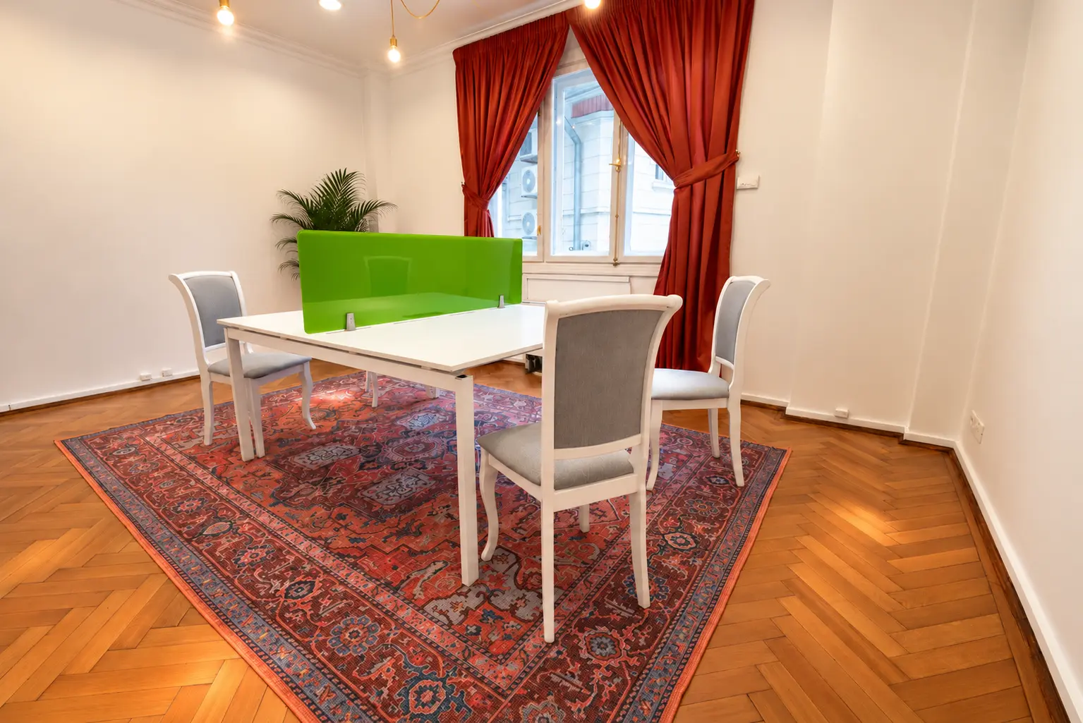 A small meeting table with a green divider
