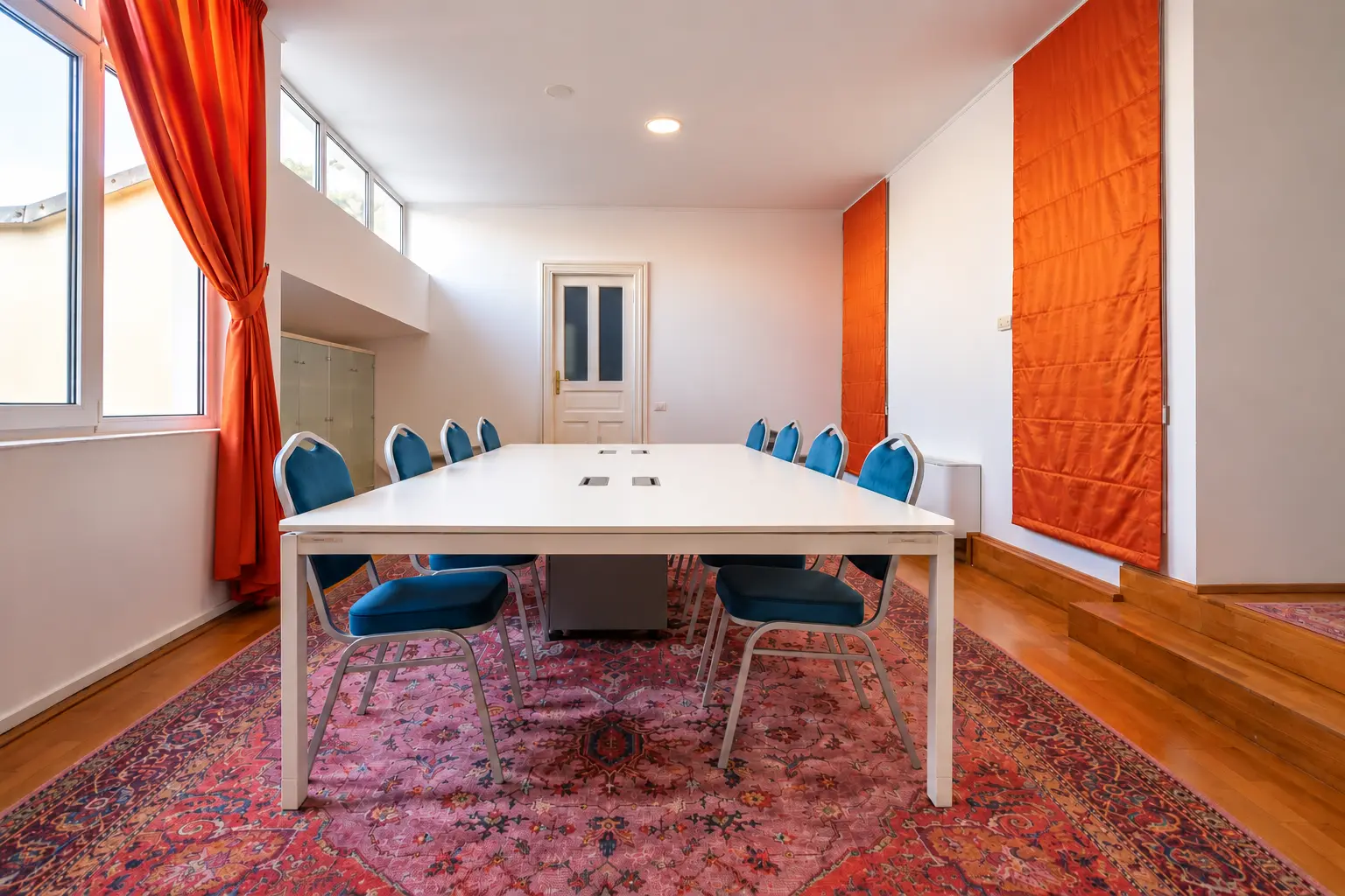 Conference table with blue chairs